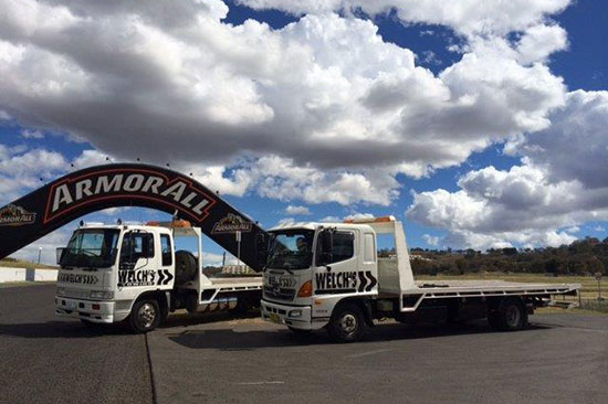 Flatbed tow truck loading a vehicle